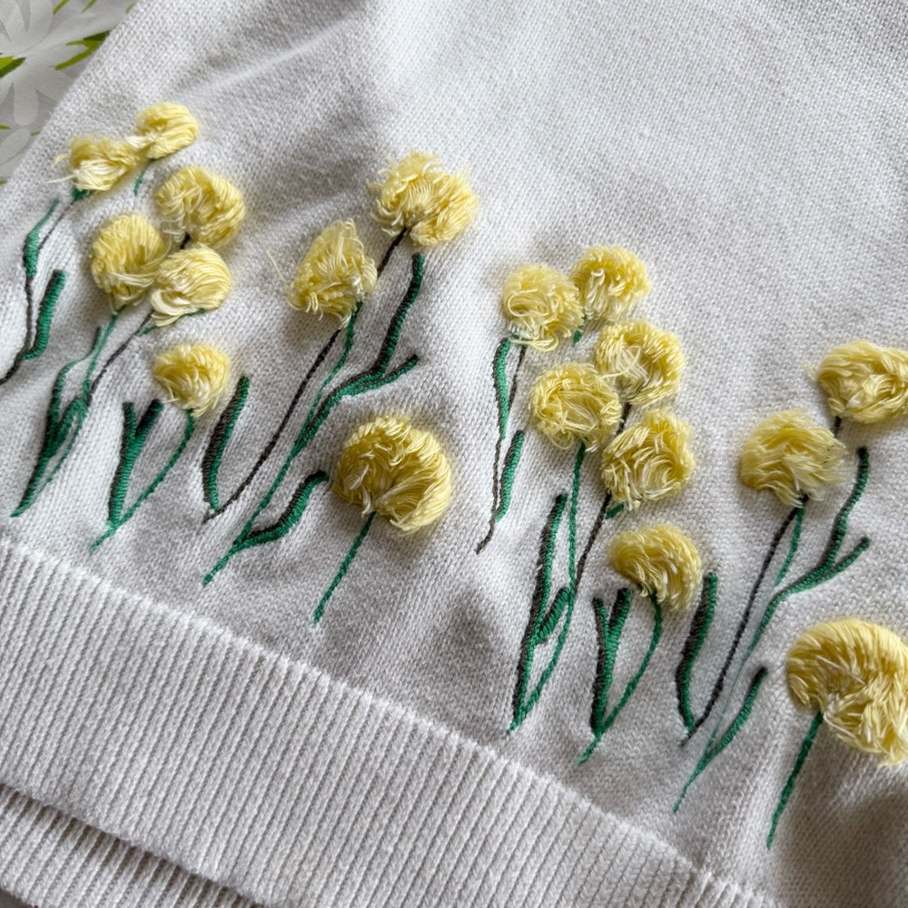 Talbots small white sweater with 3D dandelion flower details.